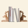 Wooden deer head bookends with natural grain finish and detailed antlers.