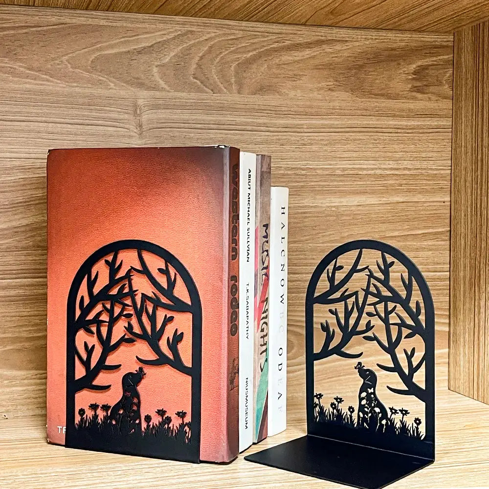 decorative bookend with cat and dog motifs