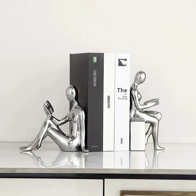 bookend featuring a ceramic reader design