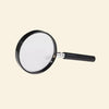 Black-handled magnifying glass with a clear lens and metallic joint.