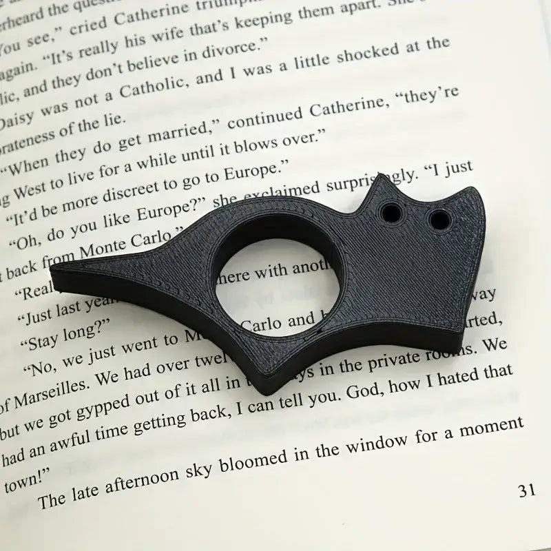adjustable book holder with thumb grip
