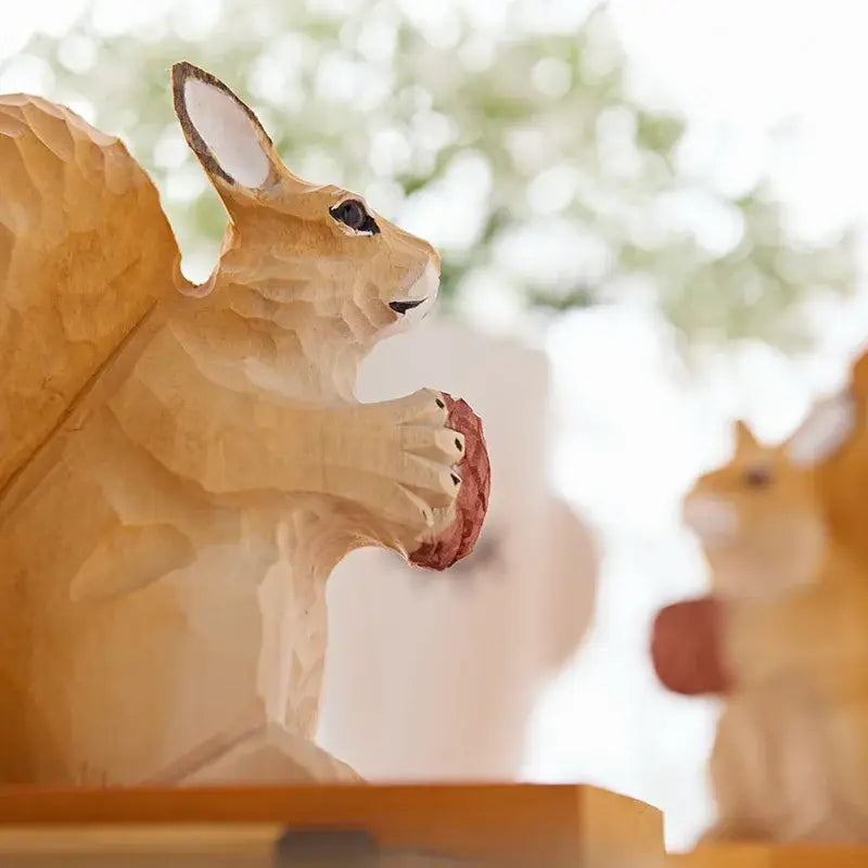 decorative wooden bookend featuring a squirrel