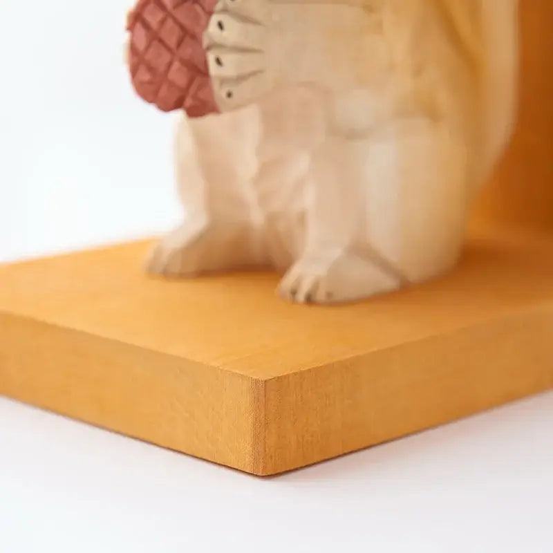 handcrafted wooden bookend in the shape of a squirrel